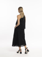 Model in Style X Lab Refraction Skirt Black back View made longer for tall women