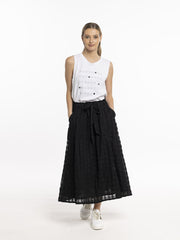 Model in Style X Lab Refraction Skirt Black Front View made longer for tall women