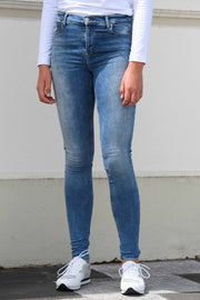 Tall model in Tanya B 34Leg Nisha Wash jeans for tall women