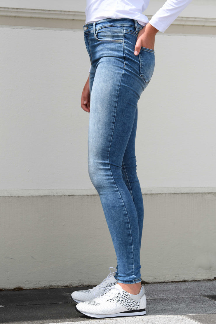 Side view of tall model in Tanya B 34Leg Nisha Wash jeans for tall women