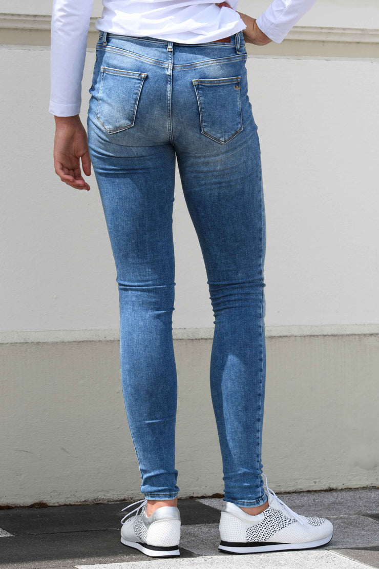 Back view of tall model in Tanya B 34Leg Nisha Wash jeans for tall women