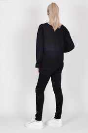 Tall model wearing Amelia Top Black, back
