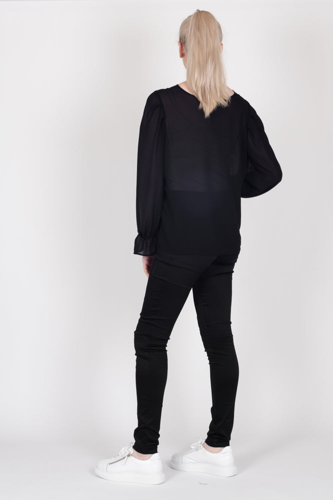 Tall model wearing Amelia Top Black, back