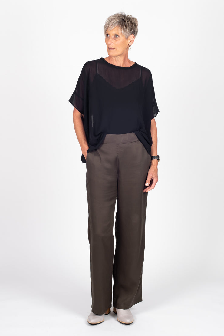 Tall model wearing Celine Pants Khaki, front