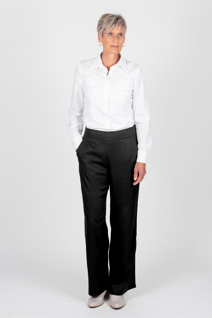 Tall model wearing Celine Pants Black
