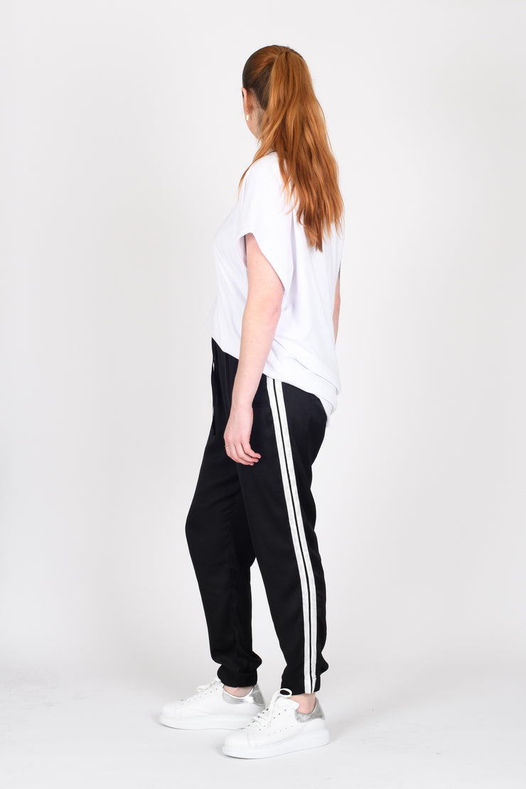 Side view of Tall model standing in Side Swipe Relax Pants for tall women