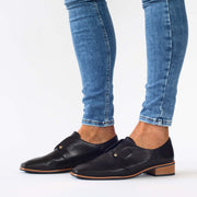 Model wearing Darby Black shoes