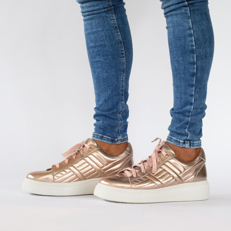 Model wearing Gelato Hendrix Rose Gold Sneakers. Womens size 44 shoes