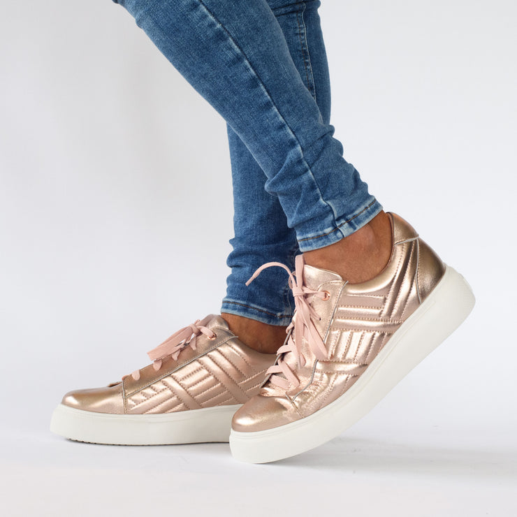 Model wearing Gelato Hendrix Rose Gold Sneakers. Womens size 43 shoes