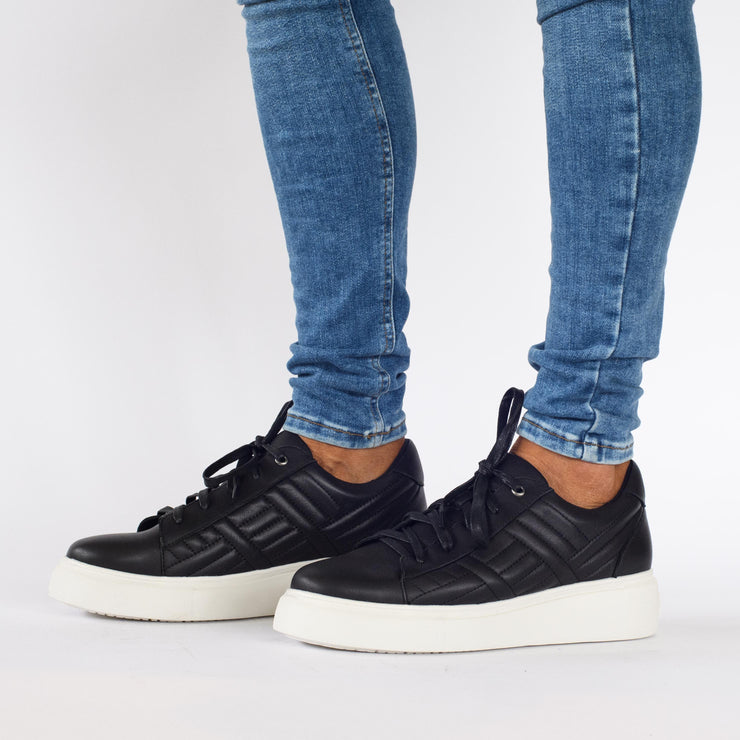 Model wearing Hendrix Black shoes