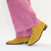Model wearing CBD brand Logger Yellow boots for women with long feet. Size 45 womens boots