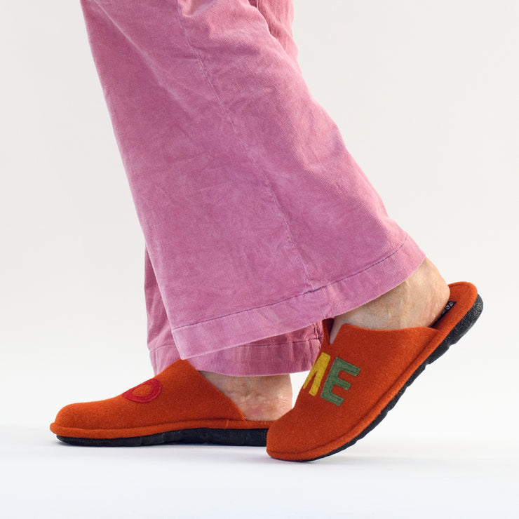 Model wearing Westland brand Lille 102 slippers in Orange. Size 44 womens slippers