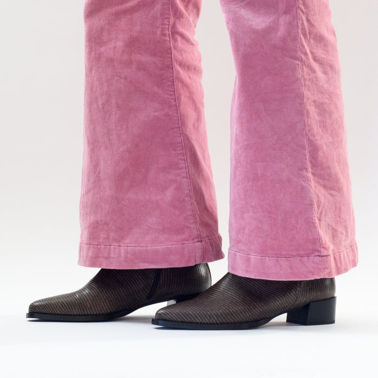 Model in Santi boots by Spanish brand Dansi in Taupe Lizard Print. Womens ankle boots in size 42, 43, 44, 45