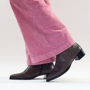 Model in Santi boots by Spanish brand Dansi in Taupe Lizard Print. Womens boots in size 42, 43, 44, 45