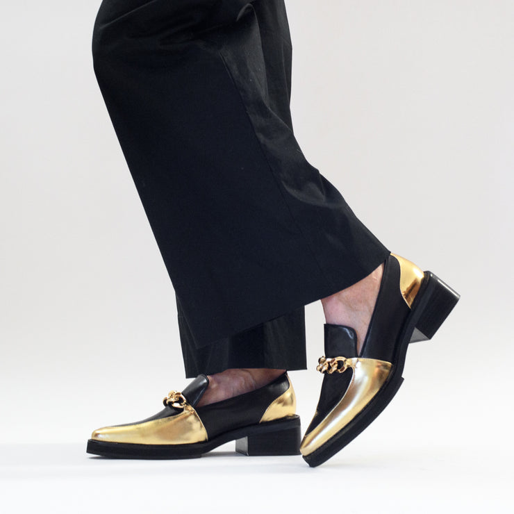 Model in Tamara London Bambino Black Gold Shoes. Womens size 46 shoes