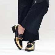 Model in Tamara London Bambino Black Gold Shoes. Womens size 45 shoes