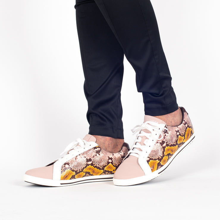 Model wearing Frankie4 Lucy II Mustard Python Print sneakers