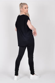 Tall model wearing Crossing The Lines Top Black, back 2