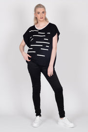 Tall model wearing Crossing The Lines Top Black, front 2