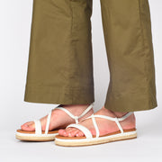 Model wearing Hush Puppies Kasos White Sandal for long feet. Size 10 womens shoes