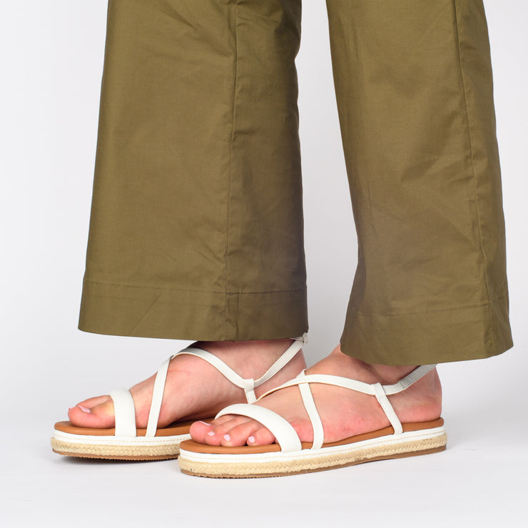Model wearing Hush Puppies Kasos White Sandal for long feet. Size 10 womens shoes