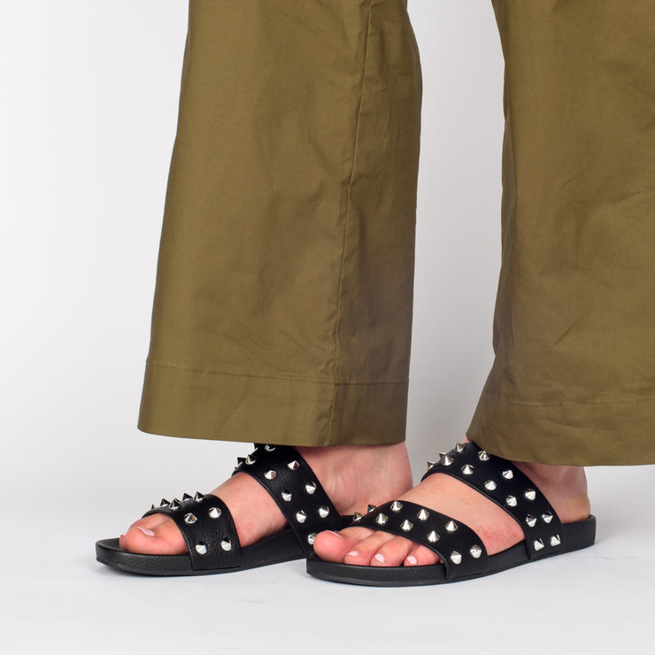 Model wearing Rollie Tide Strap Padded Stud Sandals. Size 46 womens slide
