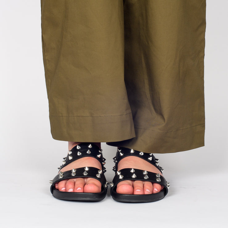 Model wearing Rollie Tide Strap Padded Stud Sandals. Size 43 womens slide