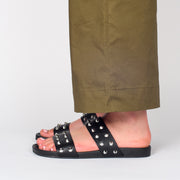 Model wearing Rollie Tide Strap Padded Stud Sandals. Size 44 womens slide