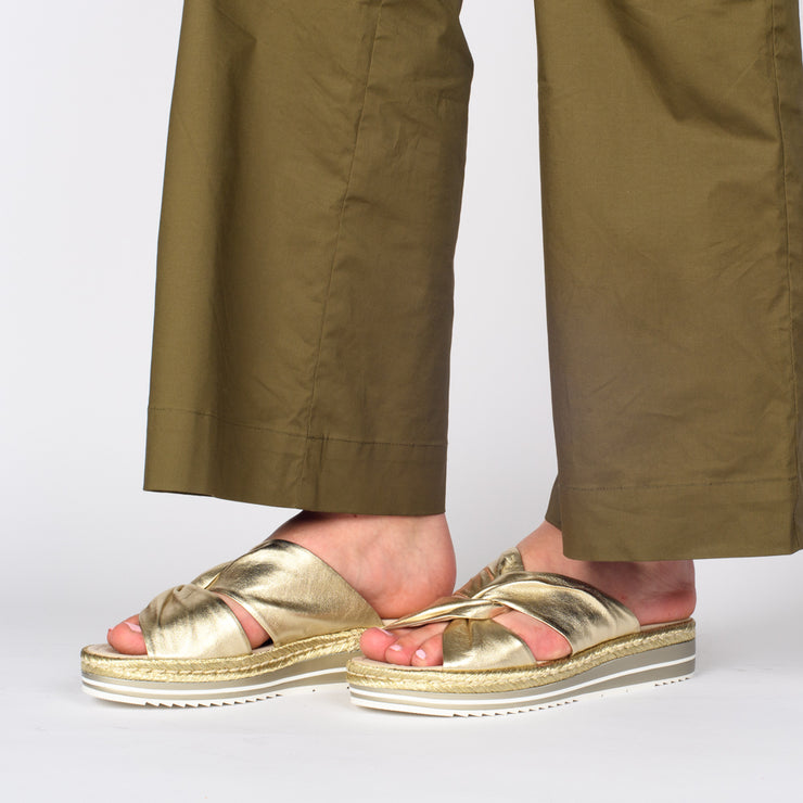 Model wearing Django and Juliette Acton Pale Gold slides. Size 45 womens sandals