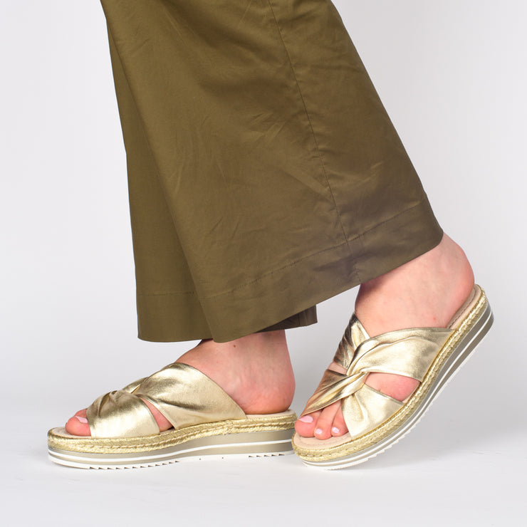 Model wearing Django and Juliette Acton Pale Gold slides. Size 43 womens sandals