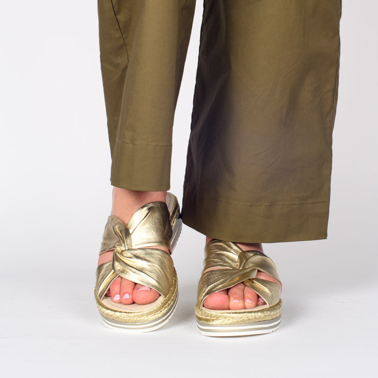 Model wearing Django and Juliette Acton Pale Gold slides. Size 42 womens sandals