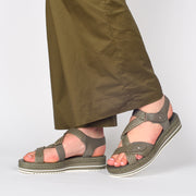 Model wearing Django and Juliette Adelyna Dark Khaki Sandals. Size 43 womens shoes