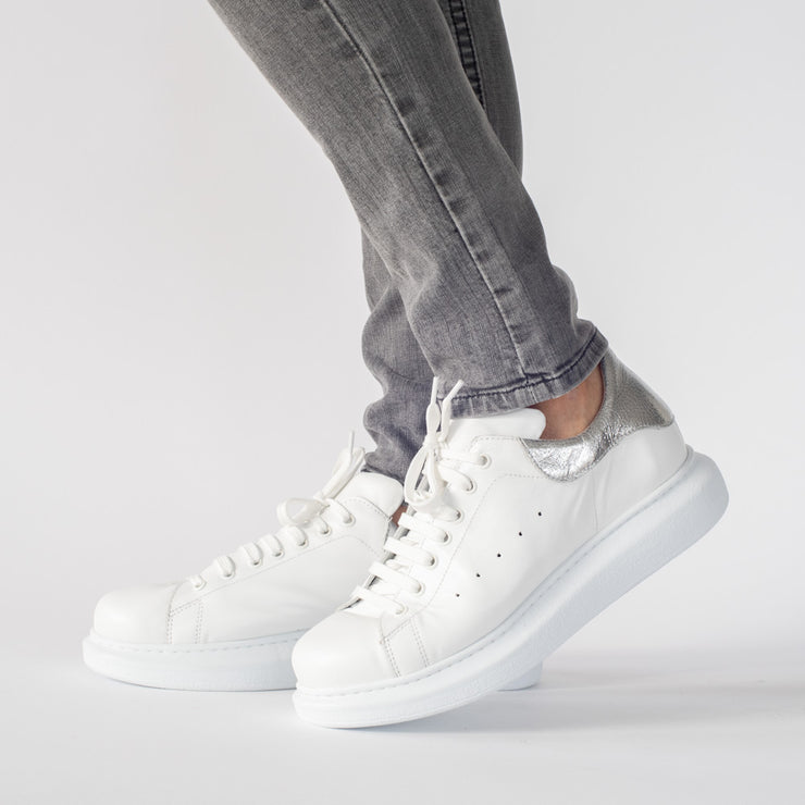 Model wearing Babouche Lifestyle Punk White Silver. Size 12 women's shoes