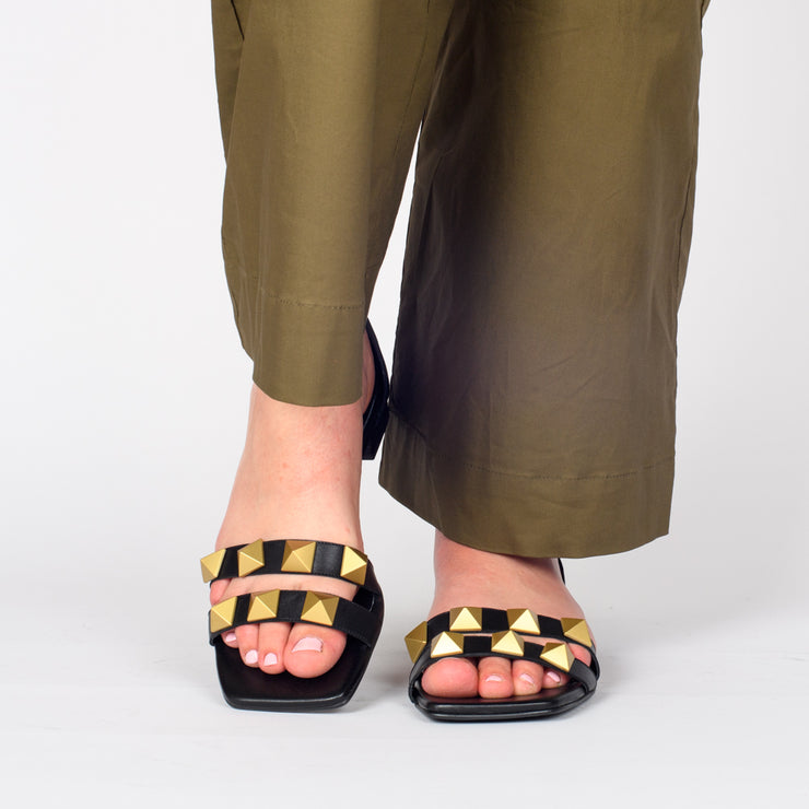 Model wearing Dansi Althea Black Sandals. Size 44 womens shoes