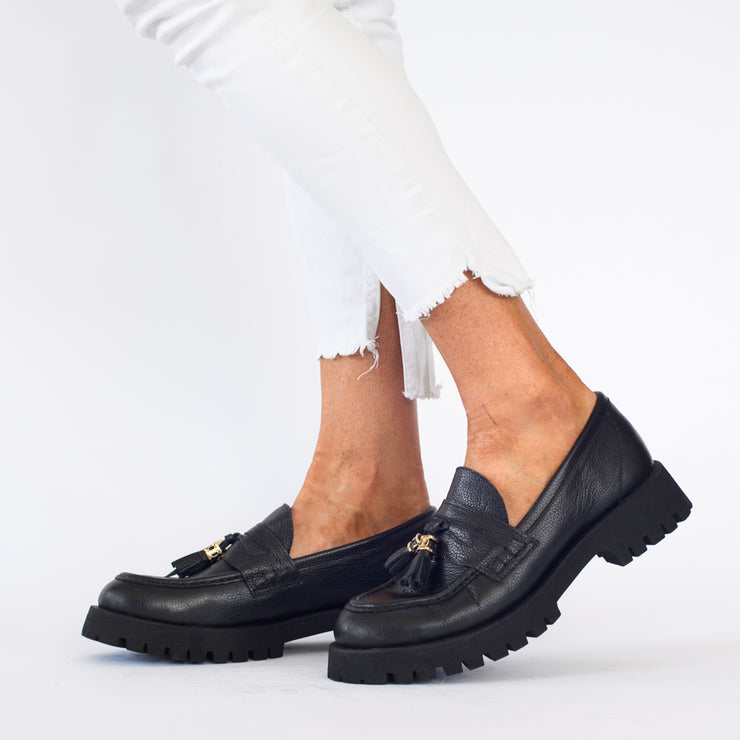 Model wearing Babouche Lifestyle Rizzo Black shoes. Womens size 45 shoes