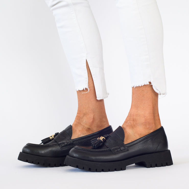 Model wearing Babouche Lifestyle Rizzo Black shoes. Womens size 43 shoes
