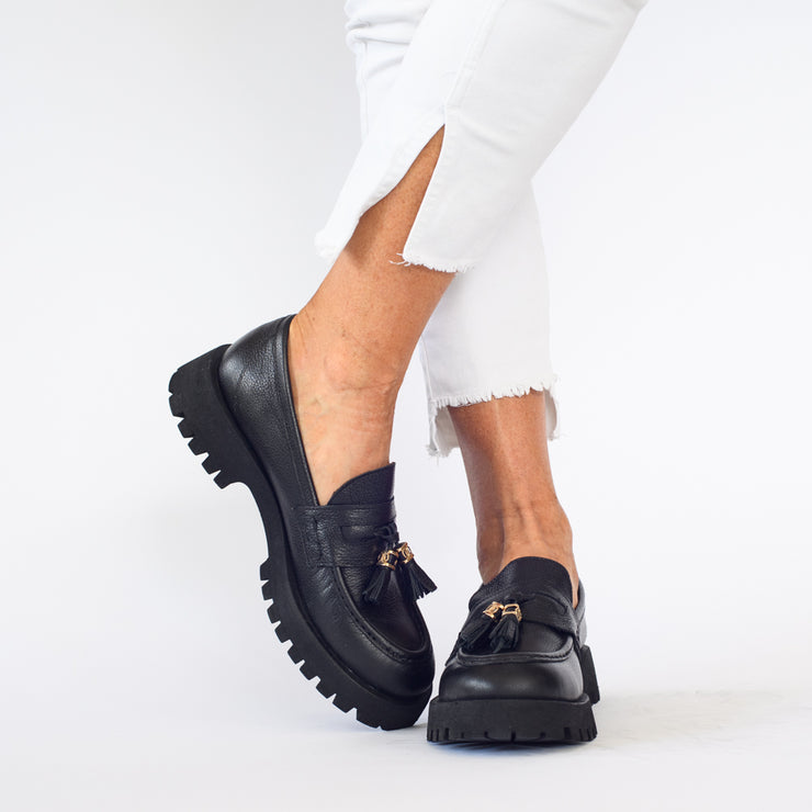 Model wearing Babouche Lifestyle Rizzo Black shoes. Womens size 44 shoes