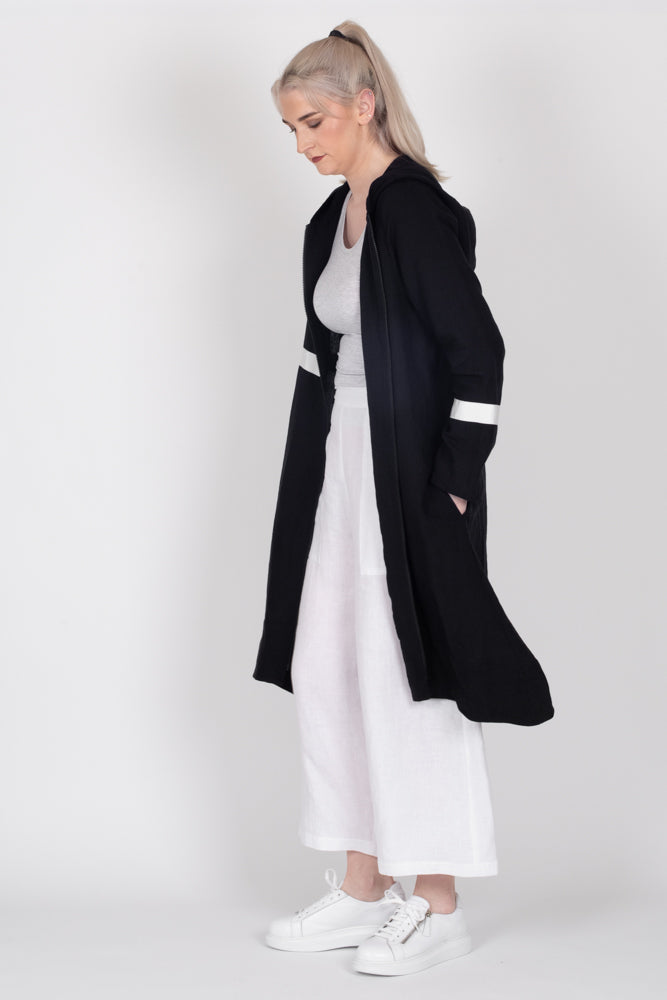 Tall model wearing Linen Coat Black, side