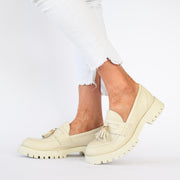 Model wearing Babouche Lifestyle Rizzo Ivory shoes. Womens size 45 shoes