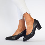 Model wearing Hush Puppies The Point Black court shoes. Womens size 10 shoes