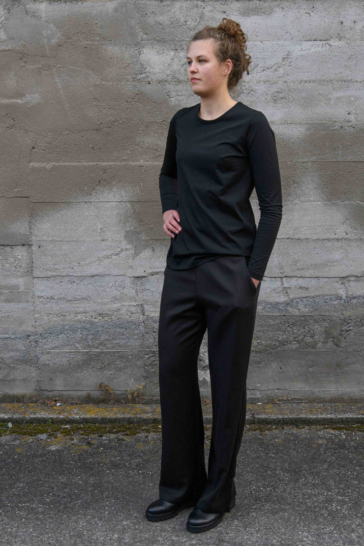 Tall model wearing Staple and Cloth brand Celine Pants in Black