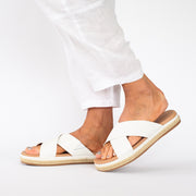 Model wearing Kelani White slides. Size 12 sandals