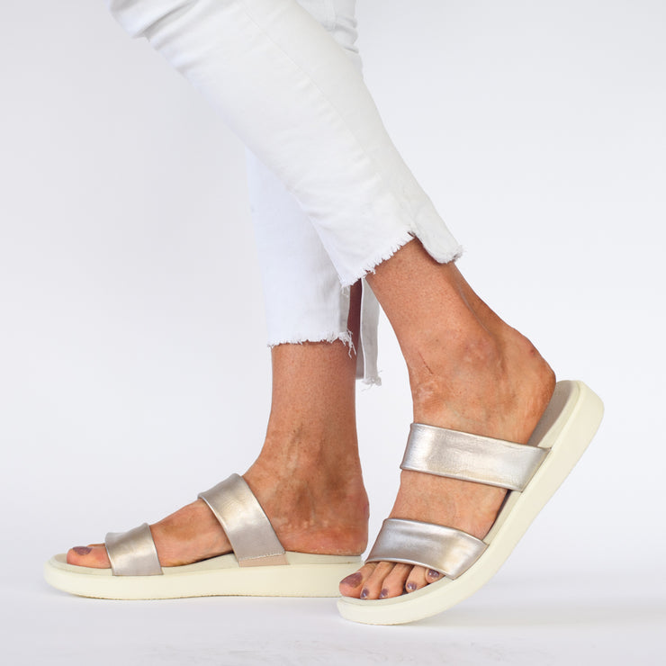 Model wearing Cassini Mellow Platinum slides for long feet. Womens size 42 sandals