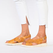 Model wearing Rosa Tan Patent sandals for long feet
