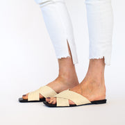 Model wearing Minx Megs Ivory slides. Womens Size 43 sandals