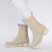 Model wearing Babouche Lifestyle Remy Beige Suede boots. Womens size 45 boots