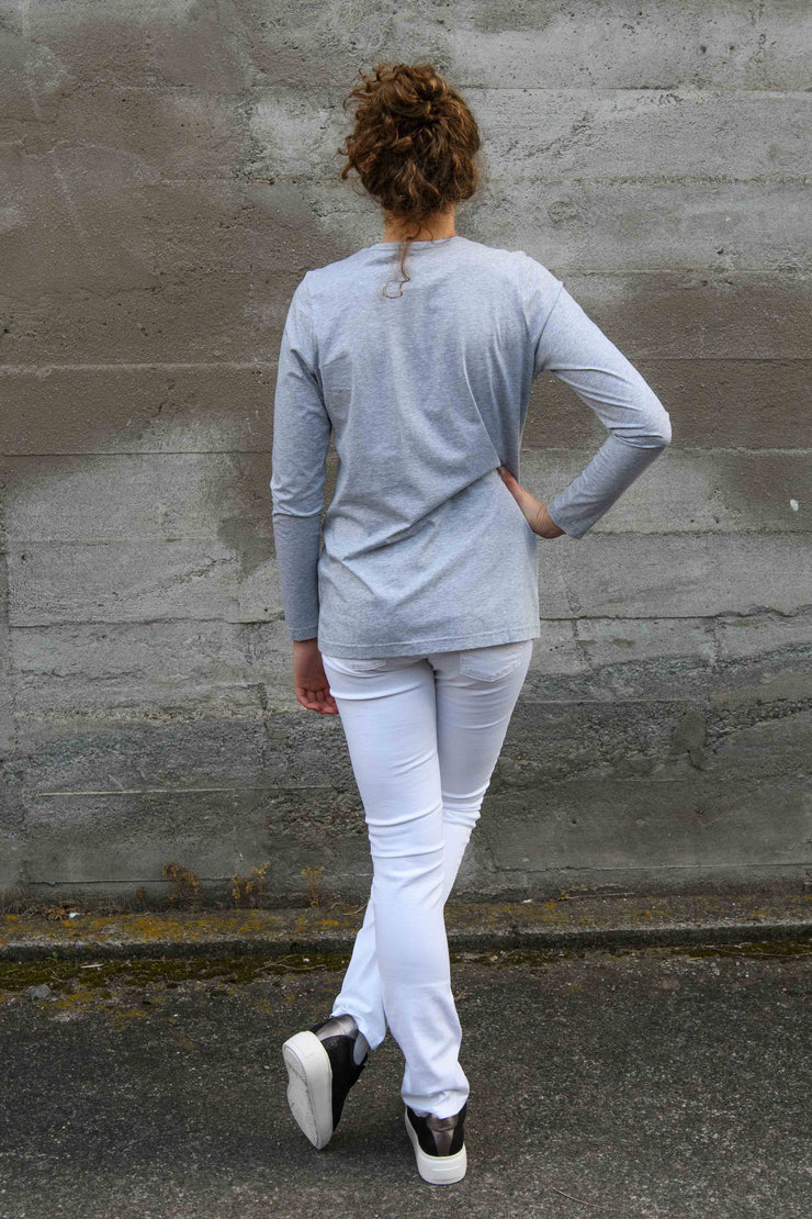 Back of tall model wearing Penny Tee in Grey Marle with Aspen Y jeans in White