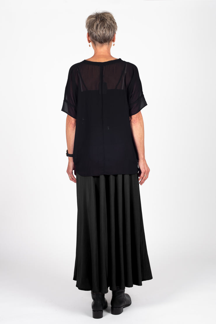 Model wearing Paris Skirt Black back with top out