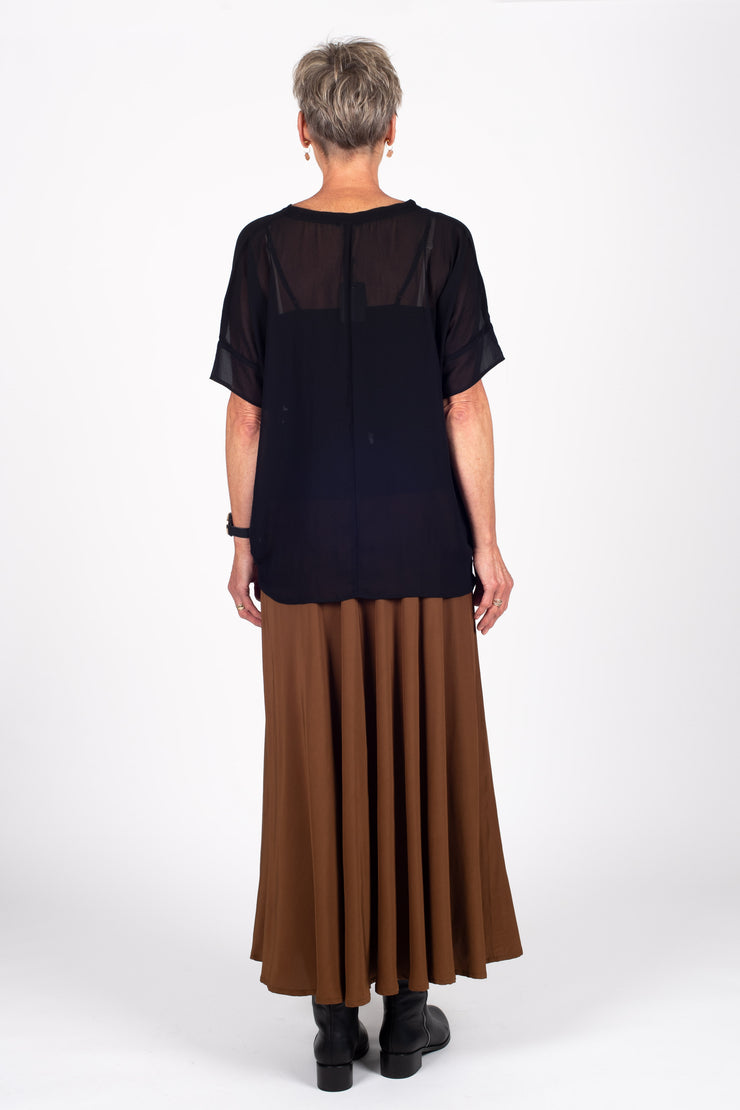 Tall model wearing Paris Skirt Cinnamon with top out