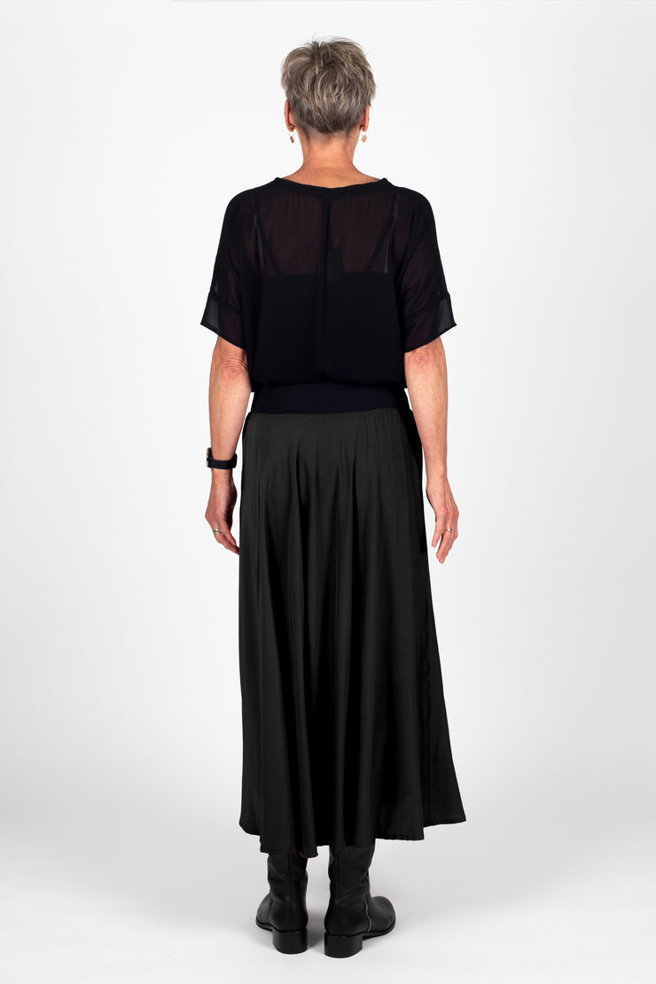 Model wearing Paris Skirt Black back with top in